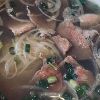 Phở Tái · Rare steak rice noodle soup.