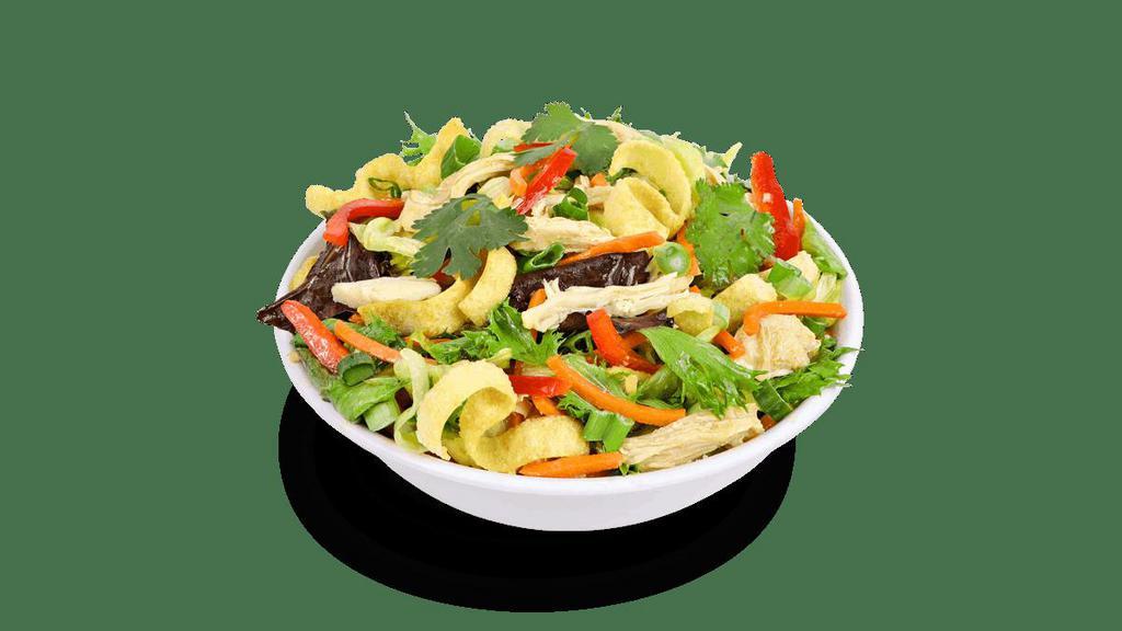 Asian Chopped Chicken Salad · Tender, hand-pulled white meat chicken, carrots, red bell peppers, cilantro, scallions and crispy wontons. Served over a bed of mixed greens and tossed in a sesame ginger vinaigrette.