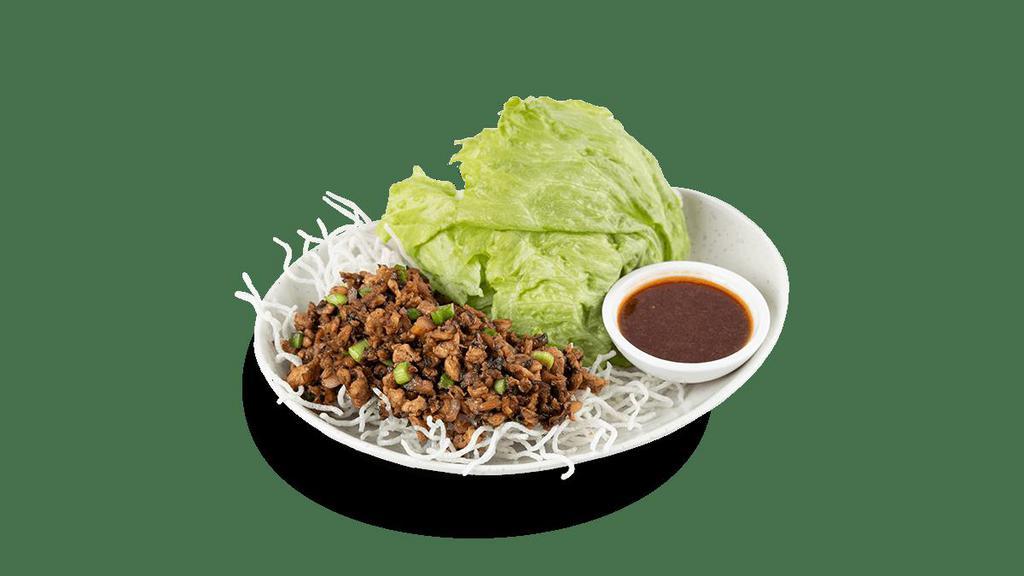 Signature Chicken Lettuce Wraps · Tender, house-ground chicken, shiitake mushrooms, water chestnuts, scallions and garlic. Wok-tossed in a savory soy sauce and served over a bed of crispy rice sticks with crisp iceberg lettuce..