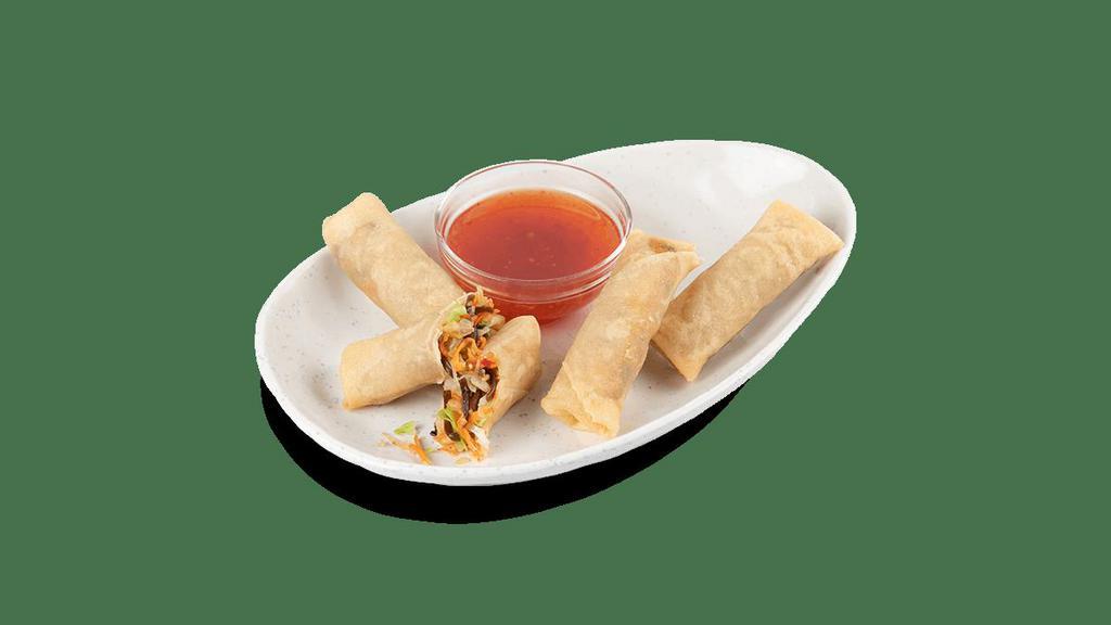 Vegetable Spring Roll · Crispy vegetable spring rolls filled with green cabbage, ginger, carrots, celery, black mushrooms, onions and glass noodles. Served with a sweet chili sauce..
