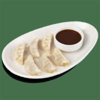 Chicken Dumplings · Steamed dumplings filled with chicken, cabbage, shallots, ginger and scallions..