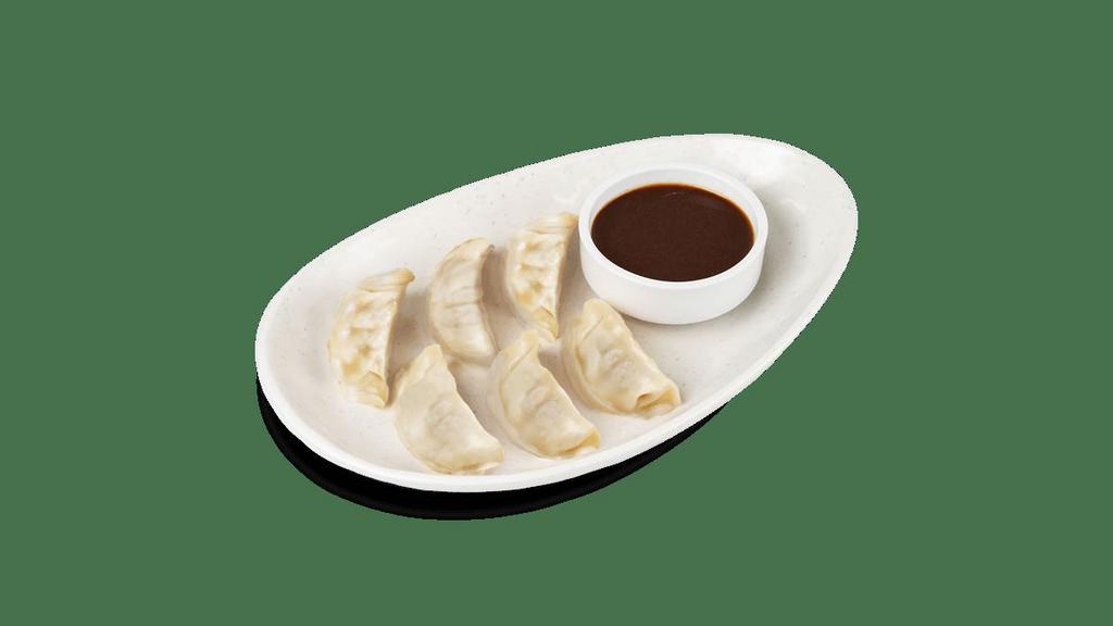 Chicken Dumplings · Steamed dumplings filled with chicken, cabbage, shallots, ginger and scallions..