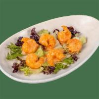 Yum Yum Shrimp · Crispy, hand-battered shrimp tossed in our sweet, creamy Yum Yum sauce. Served over a lettuc...