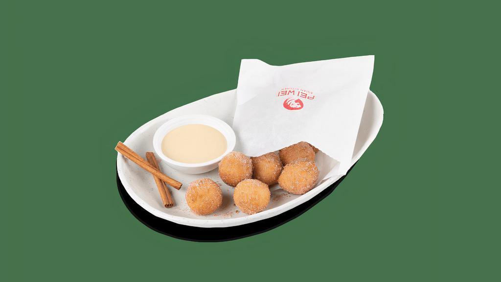 Thai Donuts · Warm, scratch-made donuts. Tossed with Saigon cinnamon and cane sugar and served with a sweetened condensed milk dipping sauce..