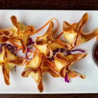 Cream Cheese Wonton · House marinated cream cheese served with sweet and sour sauce.