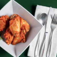 Buffalo Wings (20) · 20-Large premium wings slightly spicy, bone-in.  Choice of ranch, blue cheese or buffalo dip...