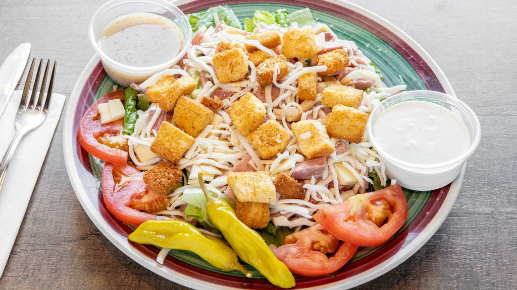 Antipasto Salad · Lettuce, Mozzarella cheese, tomato, ham, salami, olives, pepperoncini, and croutons.