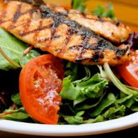 Salmon Salad · Chargrilled salmon, caramelized soy glaze, mixed greens, tomatoes, homemade sesame dressing.