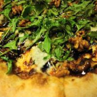 Pizza Pere & Gorgonzola · Gorgonzola cheese, mozzarella, pear, shallots, walnuts, balsamic reduction, and arugula.
