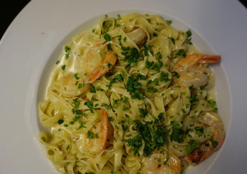 Pasta Shrimp Scampi Cream · Shrimp sauteed in olive oil, red pepper flakes, and a creamy lemon garlic sauce.