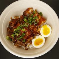 Adobo Bowl · Braised pork belly, adobo sauce, soft boiled egg, scallions, rice.