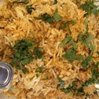 Chicken Biryani · Chicken and basmati rice cooked together with fresh mint and saffron. Served with a side of ...