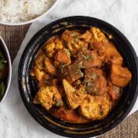Aloo Gobhi Curry · Fresh cauliflower, young potatoes sauteed with onions, tomatoes, and ginger.