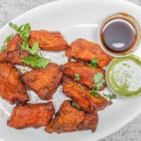 Fish Pakora (9 Pcs) · Boneless fish fillets cooked with chickpea flour and then deep-fried until crisp.