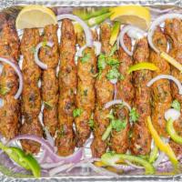 Chicken Seekh Kebabs · Ground chicken or beef mixed with special herbs and grilled in charcoal clay oven on skewers.