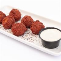 Falafel 6 Pc · Splendidly spiced chickpeas, formed and deep fried. Served with tahini sauce and pocket bread.