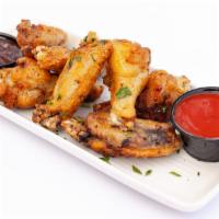 Chicken Wings 7 Pc · Deep fried and coated with your choice of sauce.