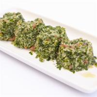 Tabbouleh · Salad of finely Chopped parsley, bulghur wheat, diced tomatoes, and onions dressed with oliv...
