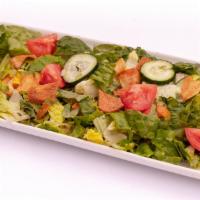 Fattoush Salad · A delightful mix of romaine lettuce, tomatoes, cucumbers, pita Crisps, spices with lemon jui...