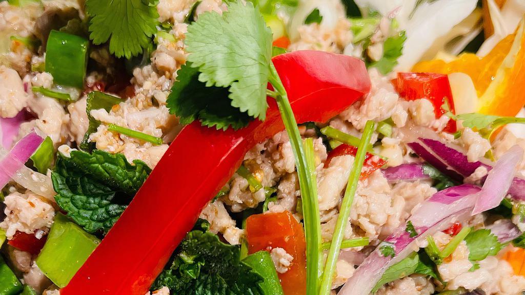 Larb Gai · Ground chicken tossed with mint, dried chili, red and green onion, and lime juice.
