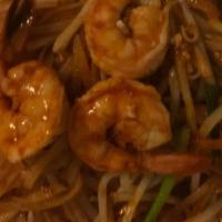 Pad Thai · Pan-fried rice noodle with prawns, tofu, green onion, bean sprout, and ground peanut.