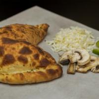 Vegetarian Calzone · Marinara sauce, mozzarella, mushrooms, red onions, green peppers, green olives and garlic