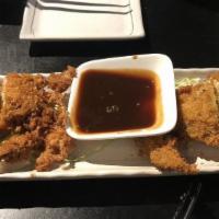 Chicken Katsu Or Tonkatsu · Choice of breaded chicken or breaded pork cutlet dipping sauce on the side.