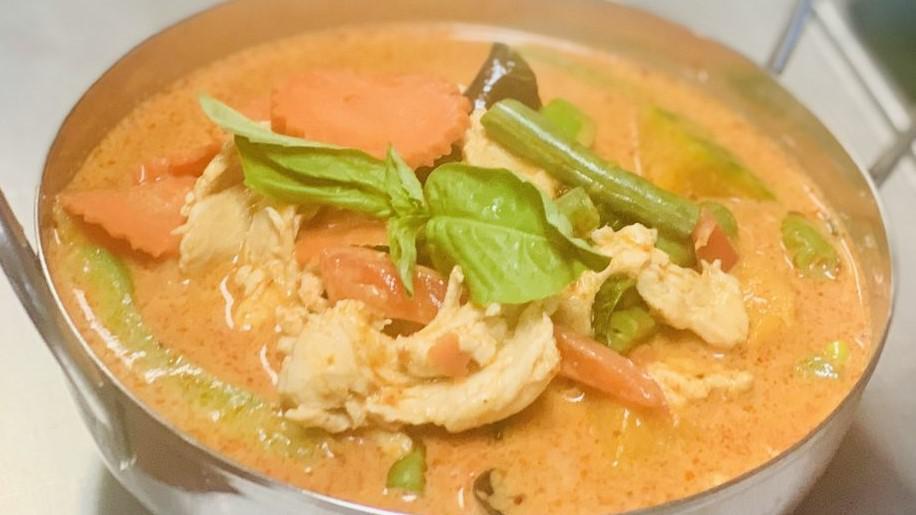 Golden Pumpkin Chicken Curry · Coconut cream broth, bell peppers, carrots, green bean, sweet basil, simmered in red house curry paste.