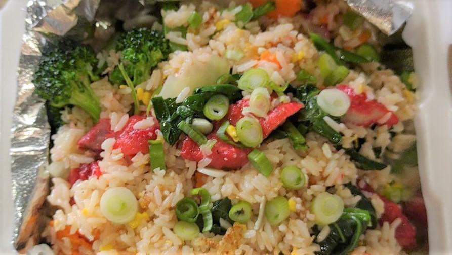 Bbq Pork Fried Rice · Stir fried jasmine rice with eggs, BBQ pork, carrots, peas, onions, garlic.