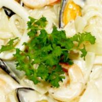 Seafood Cream Udon Pasta · Shrimp, Mussel, Squid, onion with Cream sauce Udon Pasta