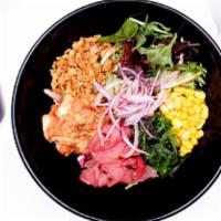 Tuna Poke Bowl · sushi rice, spring mix, seaweed salad, red onion, corn
crunch onion, Spicy Tuna poke mix wit...