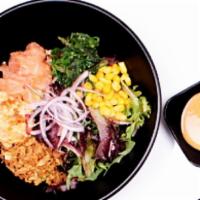 Salmon Poke Bowl · sushi rice, spring mix, seaweed salad, red onion, corn
crunch onion, Spicy Krab poke mix wit...