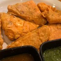 Paneer Pakoras · Spiced gram flour battered crisp fried paneer served with chutney (home-made cheese). Served...