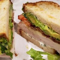 Clubber Lang · Turkey, thick cut peppered bacon, chunks of avocado, provolone, roasted garlic and herbed ma...