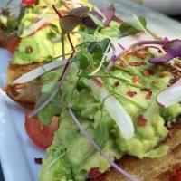 Avocado Toast · thick helping of smashed avocado, radish, crushed red pepper, cherry tomatoes, olive oil on ...