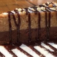 Almond Butter Cheesecake · Gluten-free. Layer of rich, dark chocolate topped with a layer of crunchy, savory almond but...