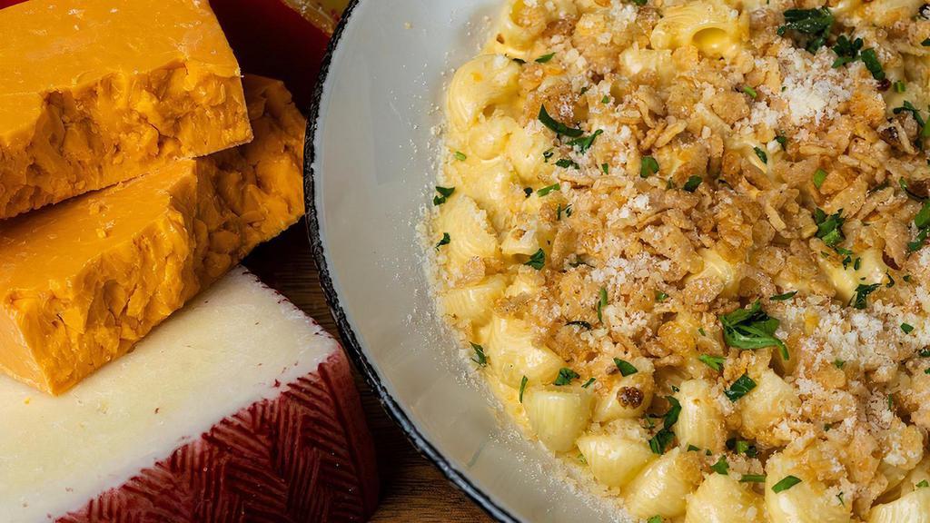 Modest Mac · mac’s cheese sauce, creamy cheddar & parmesan cheese, capped with spiced crispies & parsley