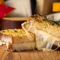 The Ogc · toasted parmesan crusted sourdough, creamy herb cheese, triple stacked with cheddar, mozzare...