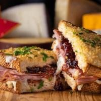 Bacon Hamma Jamma · toasted parmesan crusted sourdough, creamy herb cheese, triple stacked with cheddar, mozzare...