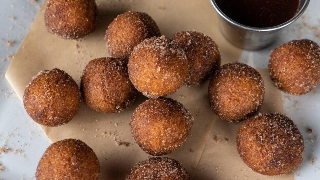 Cinnamon Donut Holes · cinnamon sugar dusted, served with rich dark chocolate sauce