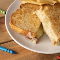 Kids Grilled Cheese · four slices of white cheddar between warm & toasty bread served with fries