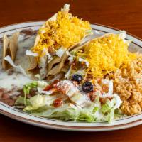 Two Crispy Tacos · Your choice of ground beef or chicken.