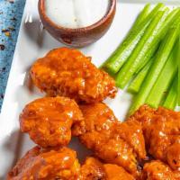 Boneless Wings · 10 pieces. Cooked wing of a chicken coated in sauce or seasoning.