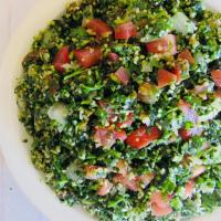 Tabouleh · Chopped parsley, tomatoes, onions and cracked wheat,  tossed with lemon juice and extra virg...