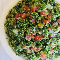 Tabouleh Salad · Chopped parsley, vegetables, cracked wheat, spices, lemon juice and olive oil.