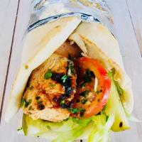 Chicken Shawarma Sandwich · Chicken marinated with special seasonings, slowly roasted, thinly sliced and wrapped in fres...