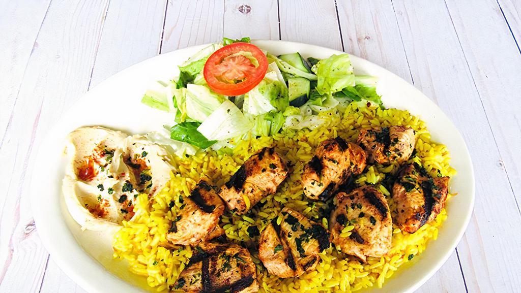 Chicken Kebab Lunch · Chicken marinated on skewers with special seasonings, and grilled to perfection. Served with rice, hummus and salad.