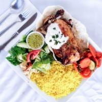 Roasted Half Chicken Dinner · Middle Eastern seasoned rotisserie chicken, topped with garlic sauce. Served with rice, humm...
