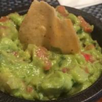 Guacamole Dip · Fresh avocado blended with onions, tomatoes, cilantro, served with warm chips and melted che...