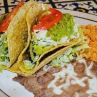 Selma Special · Two grilled steak tacos, lettuce, cheese, guacamole, tomatoes.  Served with rice & beans
